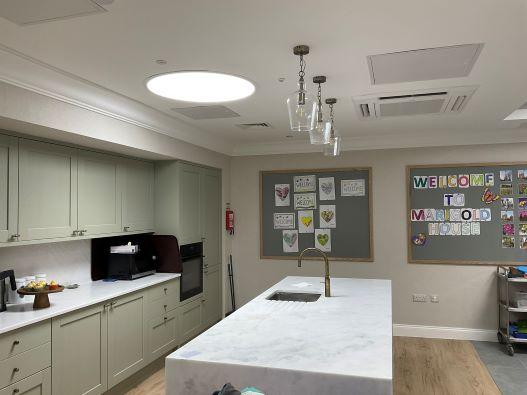 Kitchen space with middle island in the day centre room