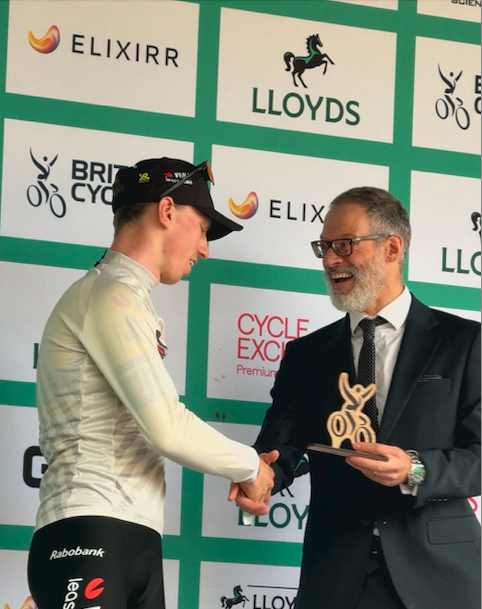 Tour of Britain - Matty Brennan receiving his 1st place award from Cllr Adam Zerny