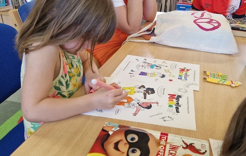 A child colouring in Stotfold Library.