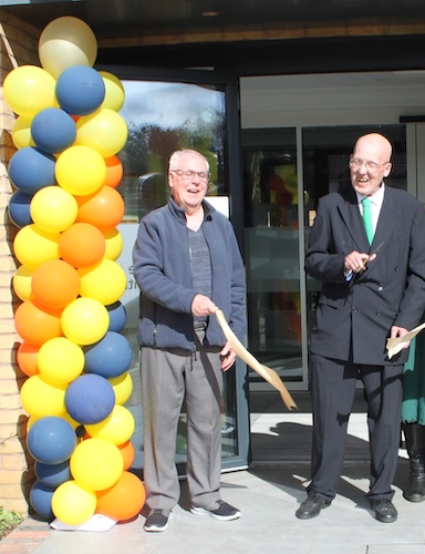 David Lowe, Day Centre user with Executive Member for Adult Social Care and Health, Cllr. Mark Smith, cutting the opening ribbon.