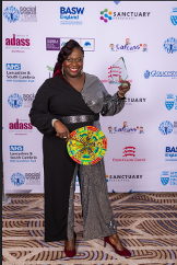 Elizabeth Badu, holding her award.