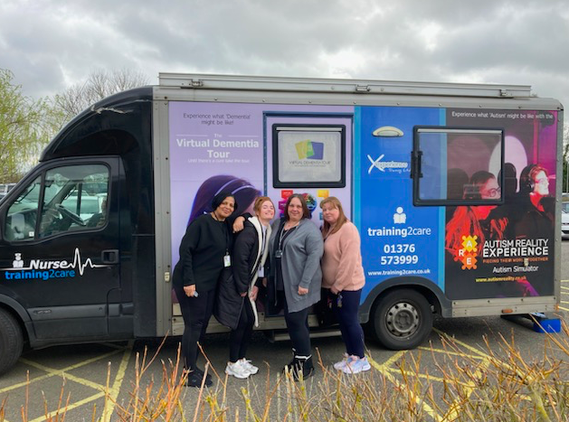Staff take part in the Autism Bus Experience