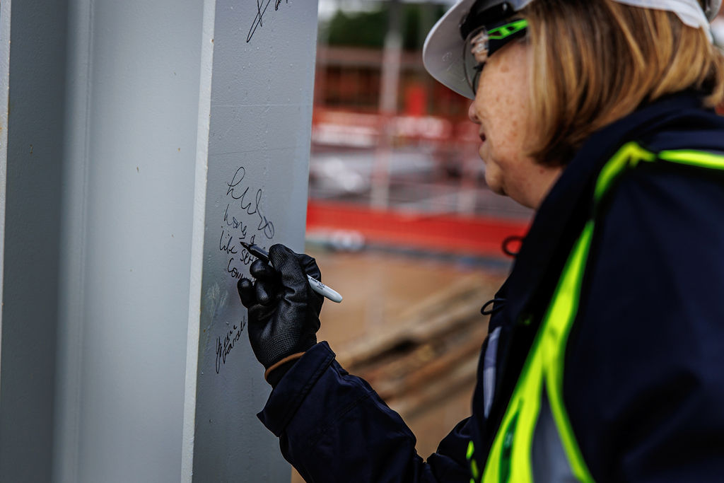 The steel beam being signed