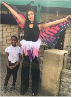 Young carer in a butterfly costume